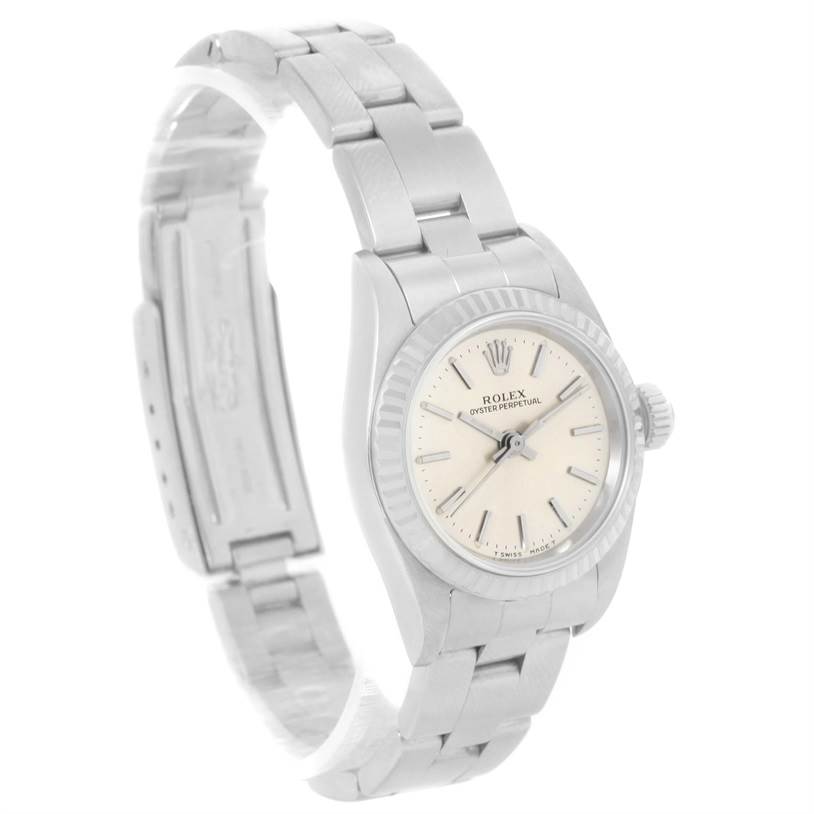 The Rolex Oyster Perpetual 67194 Women's Stainless Steel Silver Dial 67194 Women's Stainless Steel Silver Dial watch is shown from a three-quarter angle, highlighting the watch face, bezel, and bracelet.
