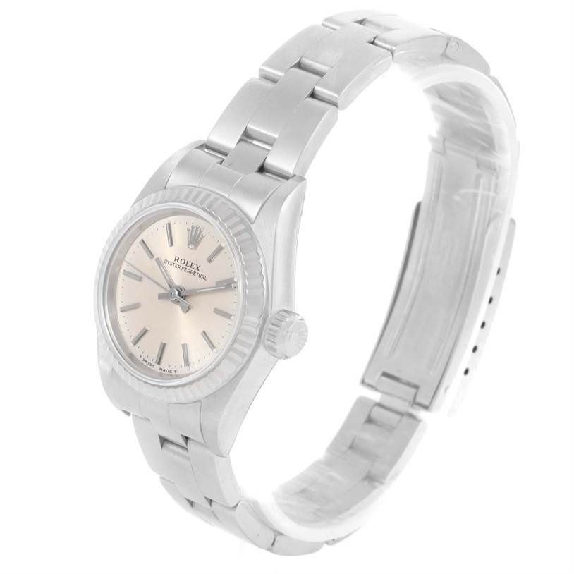 The Rolex Oyster Perpetual 67194 Women's Stainless Steel Silver Dial 67194 Women's Stainless Steel Silver Dial watch is shown at an angled view, highlighting the face, bezel, and bracelet.