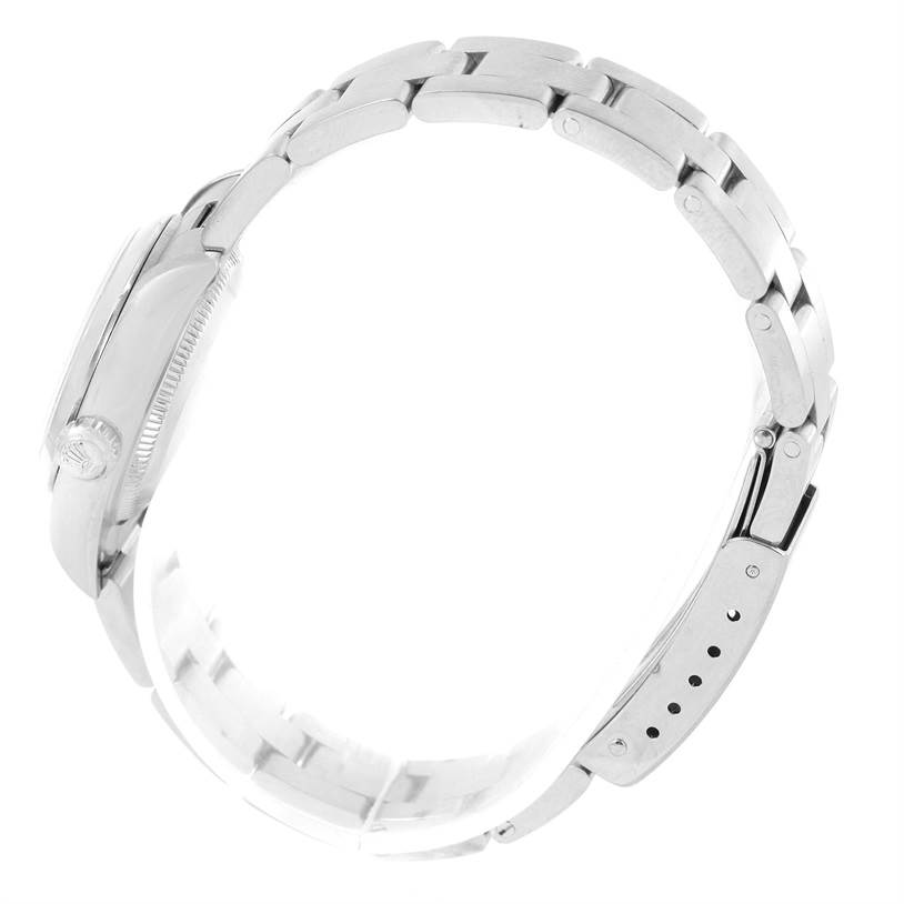 The image shows a side view of the band and case of a Rolex Oyster Perpetual 76080 Women
s Stainless Steel Blue Dial 76080 Women
s Stainless Steel Blue Dial watch.