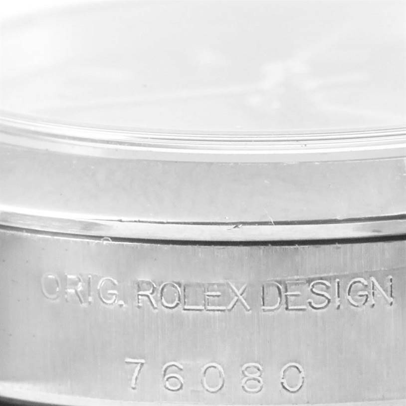 This image shows a close-up of the side of the case for an Oyster Perpetual model watch by Rolex.