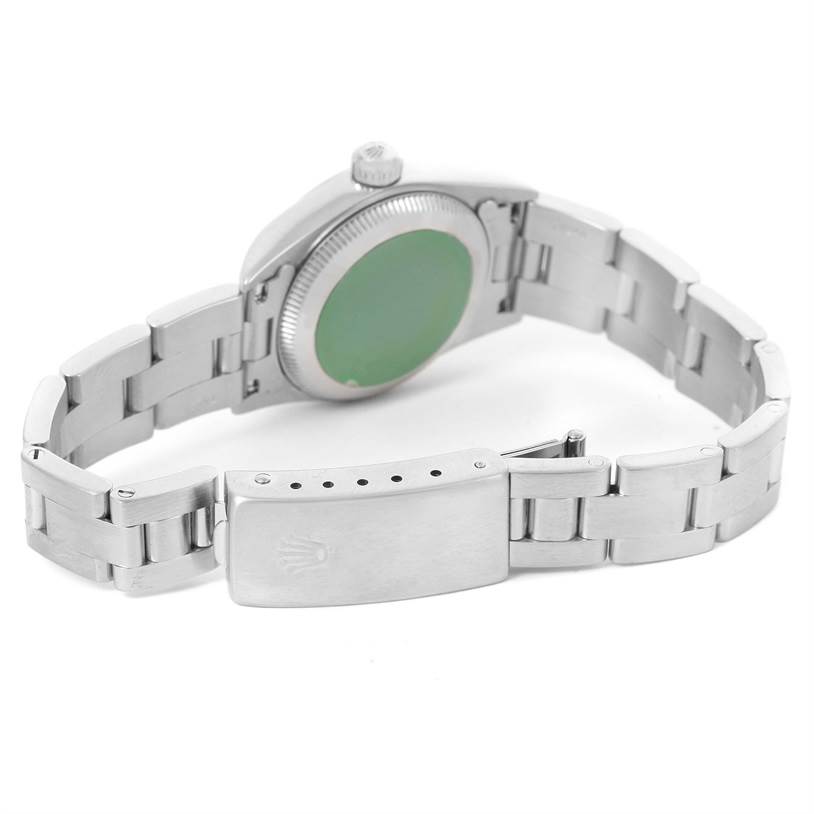 The image shows the back of the Rolex Oyster Perpetual 76080 Women's Stainless Steel Black Dial 76080 Women's Stainless Steel Black Dial watch, highlighting the case back, crown, and partially opened clasp.