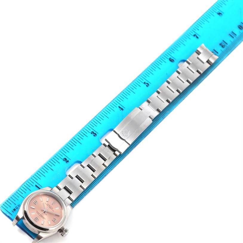 The image shows a Rolex Oyster Perpetual 176200 Women's Stainless Steel Pink Dial 176200 Women's Stainless Steel Pink Dial watch with a stainless steel bracelet measured against a blue ruler.