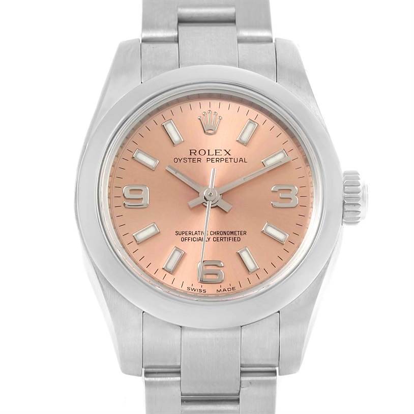 The image shows the front view of a Rolex Oyster Perpetual watch with a pinkish dial and visible bracelet.