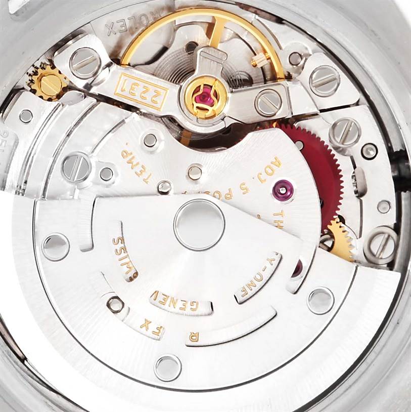 This image shows a close-up view of the movement mechanism within the Rolex Oyster Perpetual 176200 Men's Stainless Steel Pink Dial 176200 Men's Stainless Steel Pink Dial watch, highlighting gears and components.