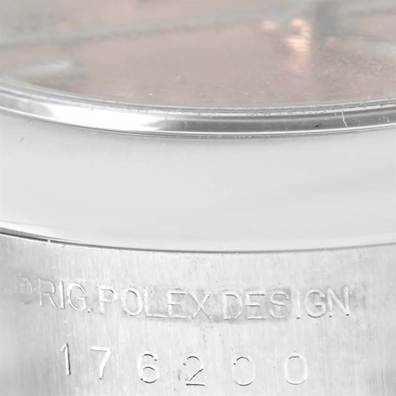 This image shows a close-up of the case side with engraved details of a Rolex Oyster Perpetual 176200 Men's Stainless Steel Pink Dial 176200 Men's Stainless Steel Pink Dial watch.