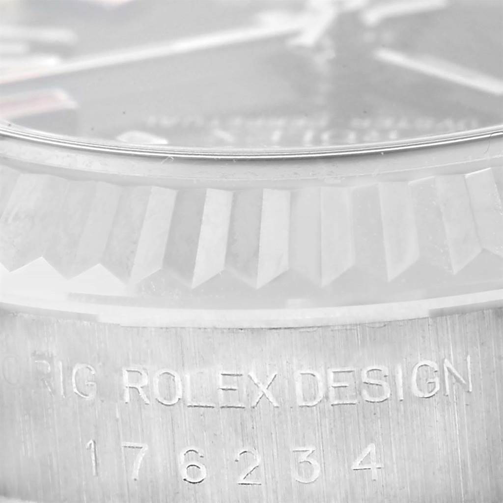 The image shows a close-up of the bezel, crystal, and engraved serial number on the case of a Rolex Oyster Perpetual 176234 Women
s Stainless Steel Black Dial 176234 Women
s Stainless Steel Black Dial watch.