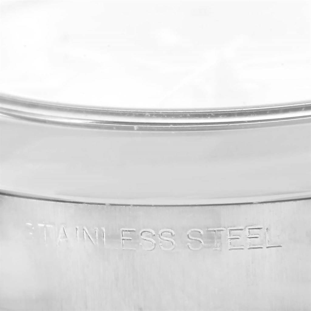 This close-up image of the Rolex Oyster Perpetual 176200 Women's Stainless Steel Pink Dial 176200 Women's Stainless Steel Pink Dial watch shows the side of the stainless steel case.