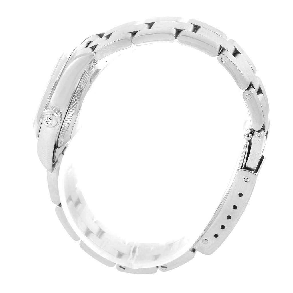 Side view of the Rolex Oyster Perpetual 76080 Women
s Stainless Steel Blue Dial 76080 Women
s Stainless Steel Blue Dial watch showcasing the case, crown, and metal bracelet with link details.