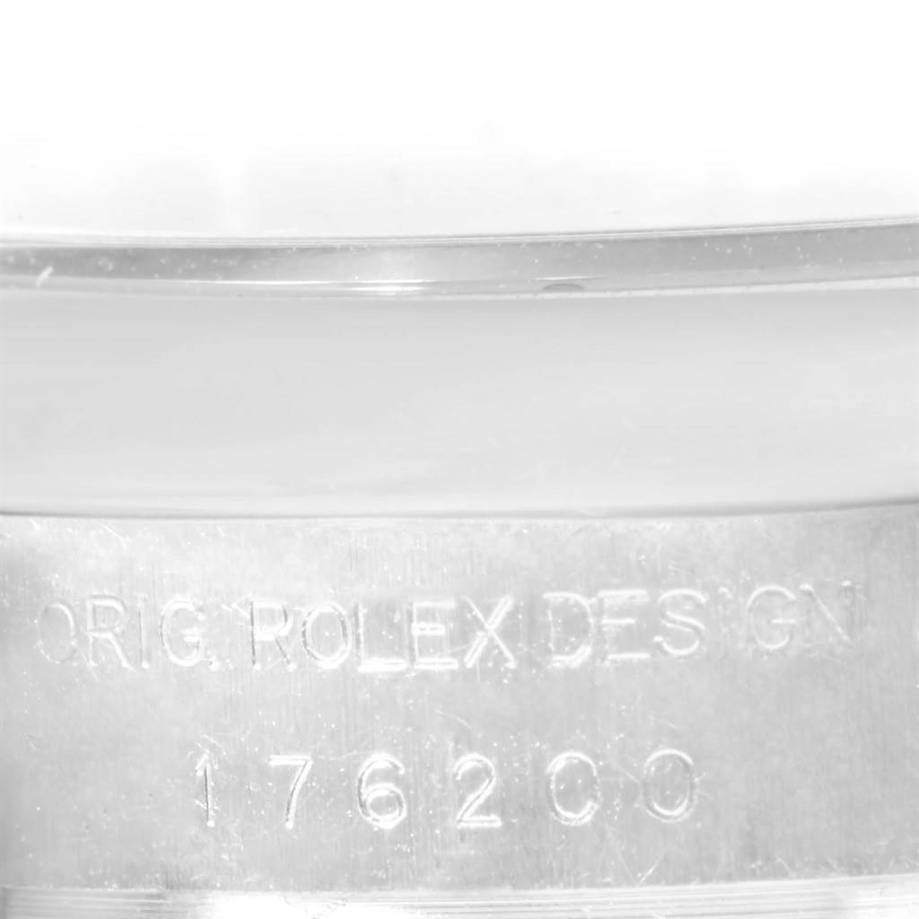 The image shows a close-up of the case side of a Rolex Oyster Perpetual 176200 Women
s Stainless Steel Silver Dial 176200 Women
s Stainless Steel Silver Dial watch, highlighting the "ORIG. ROLEX DESIGN" and model number 176200.
