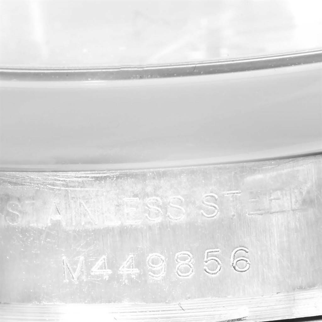The image shows a close-up of the serial number and "STAINLESS STEEL" engraving on the casing of a Rolex Oyster Perpetual 176200 Women
s Stainless Steel Silver Dial 176200 Women
s Stainless Steel Silver Dial watch.