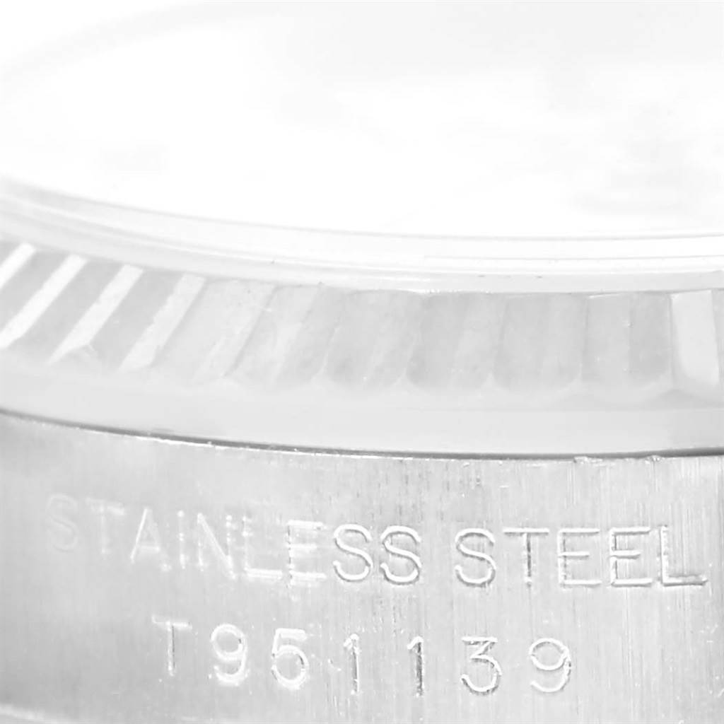 The image shows a close-up of the side of a Rolex Oyster Perpetual 67194 Women's Stainless Steel White Dial 67194 Women's Stainless Steel White Dial watch, highlighting the stainless steel case and the model number.