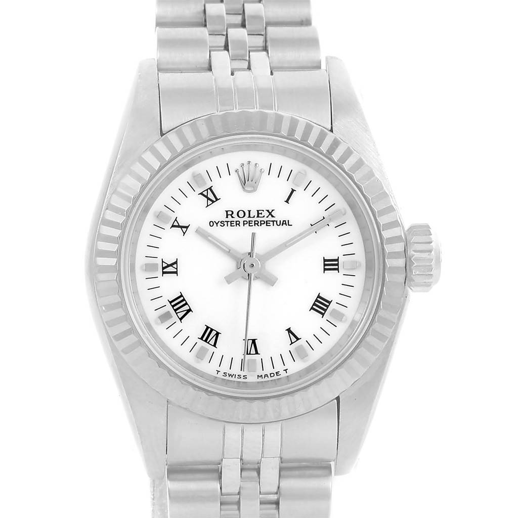 The image shows a front view of a Rolex Oyster Perpetual 67194 Women's Stainless Steel White Dial 67194 Women's Stainless Steel White Dial watch featuring its dial, bezel, crown, and part of the bracelet.