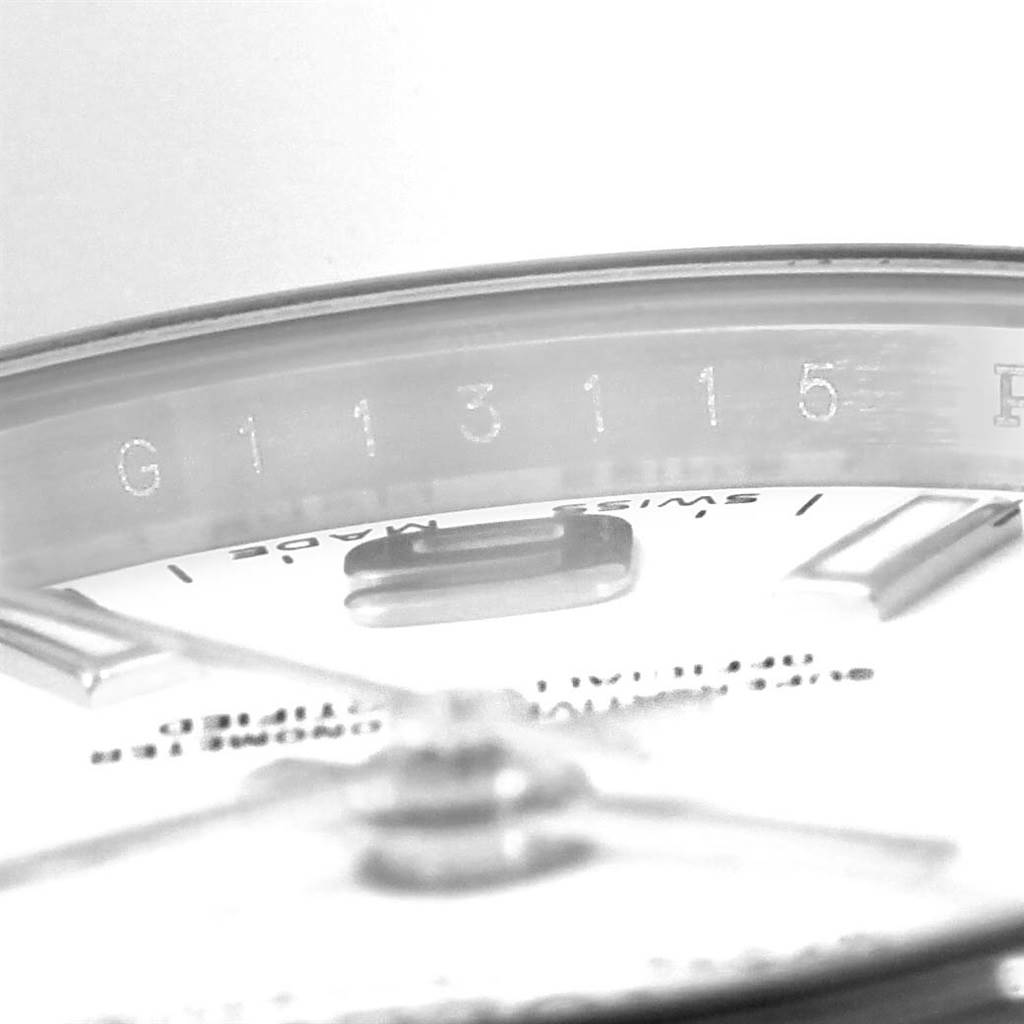 The image shows a close-up of the dial and rehaut area with engraved serial number of a Rolex Oyster Perpetual 176200 Women
s Stainless Steel White Dial 176200 Women
s Stainless Steel White Dial watch.