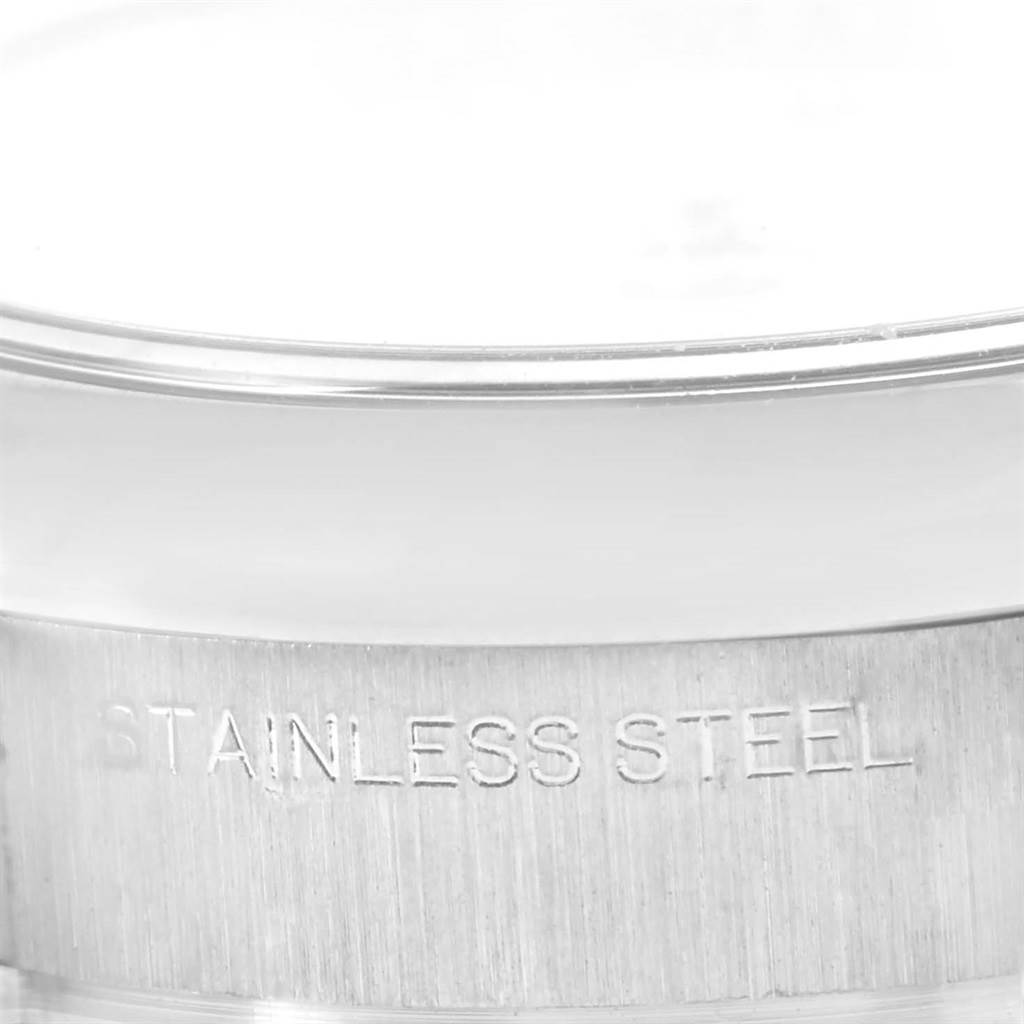 This close-up image of an Oyster Perpetual by Rolex shows the stainless steel casing with the "Stainless Steel" engraving.