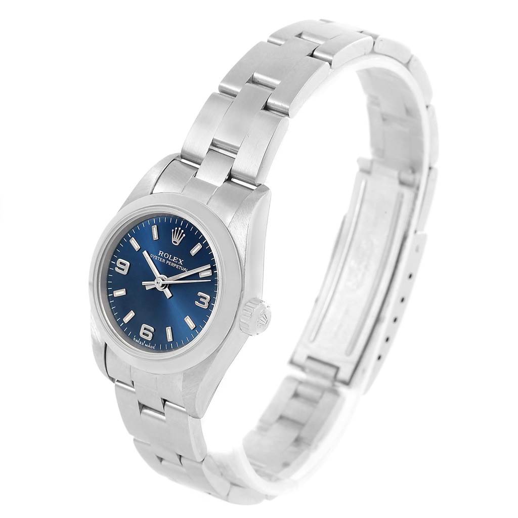 The Rolex Oyster Perpetual 67180 Men
s Stainless Steel Blue Dial 67180 Men
s Stainless Steel Blue Dial watch is shown at a three-quarter angle, displaying the face, crown, and bracelet clearly.