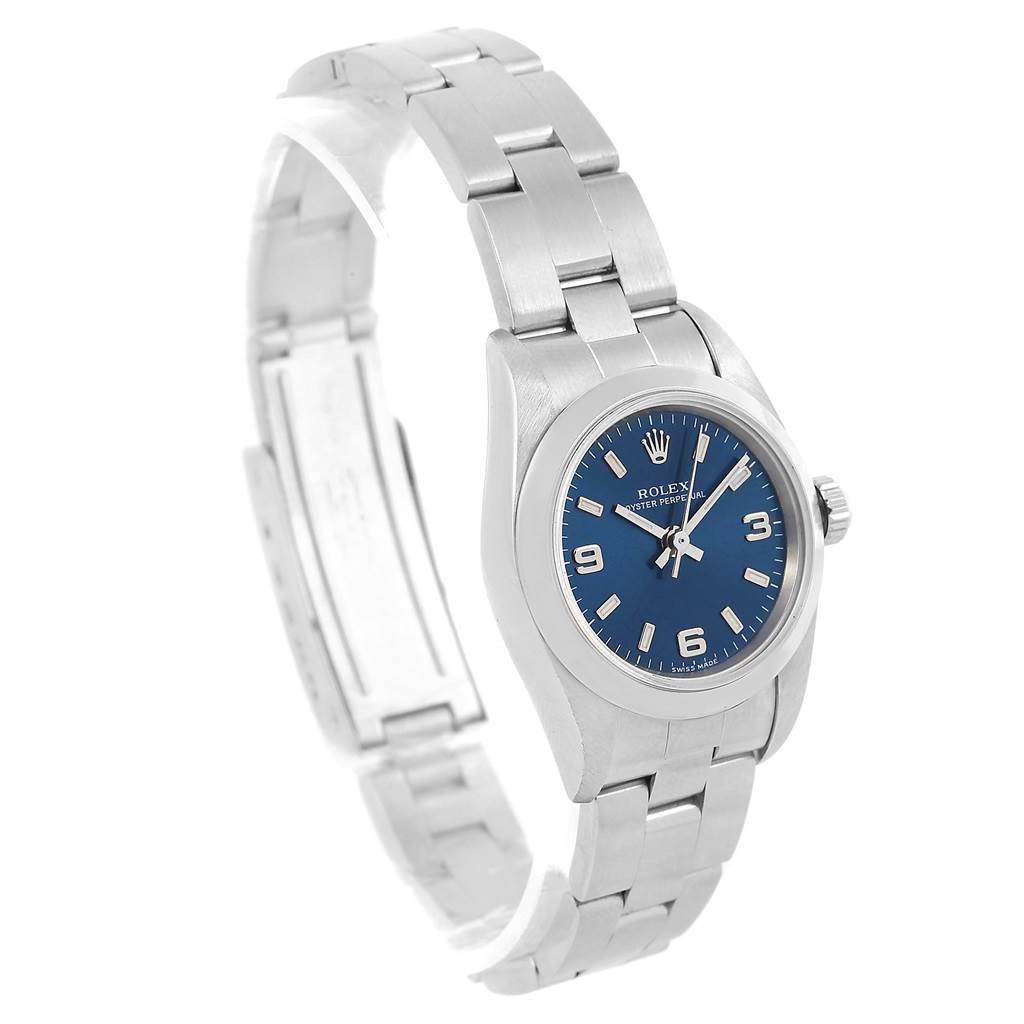 The Rolex Oyster Perpetual 67180 Men
s Stainless Steel Blue Dial 67180 Men
s Stainless Steel Blue Dial watch is shown at an angled side view, highlighting its blue dial and stainless steel bracelet.