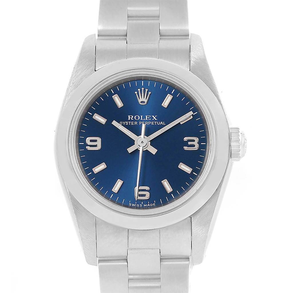 The image shows a Rolex Oyster Perpetual 67180 Men
s Stainless Steel Blue Dial 67180 Men
s Stainless Steel Blue Dial watch from the front, highlighting its blue dial and stainless steel bracelet.