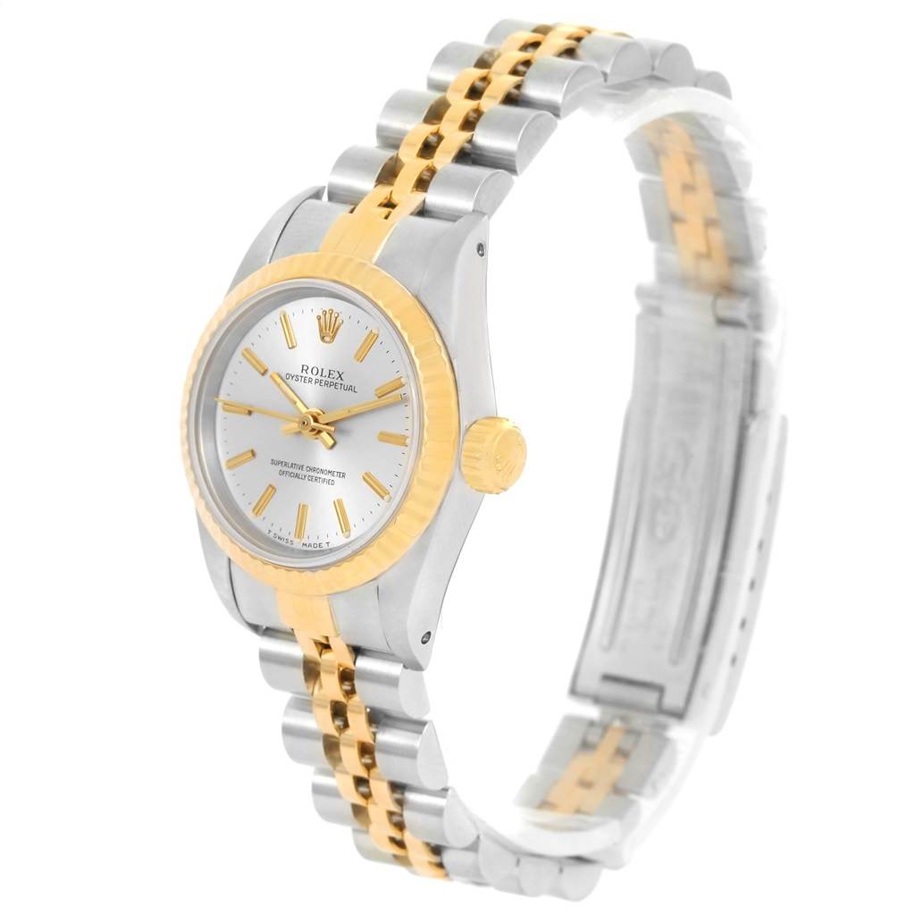 The Rolex Oyster Perpetual 67193 Women's Steel and Gold (two tone) Silver Dial 67193 Women's Steel and Gold (two tone) Silver Dial watch is shown at a slight angle, highlighting its gold and silver bracelet, crown, and dial.