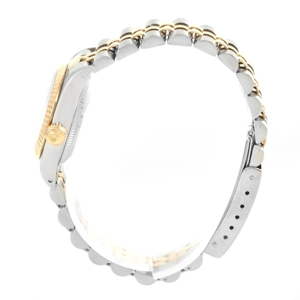 The image shows a side view of the Rolex Oyster Perpetual 67193 Women's Steel and Gold (two tone) Silver Dial 67193 Women's Steel and Gold (two tone) Silver Dial watch, highlighting the bracelet, case, and crown.