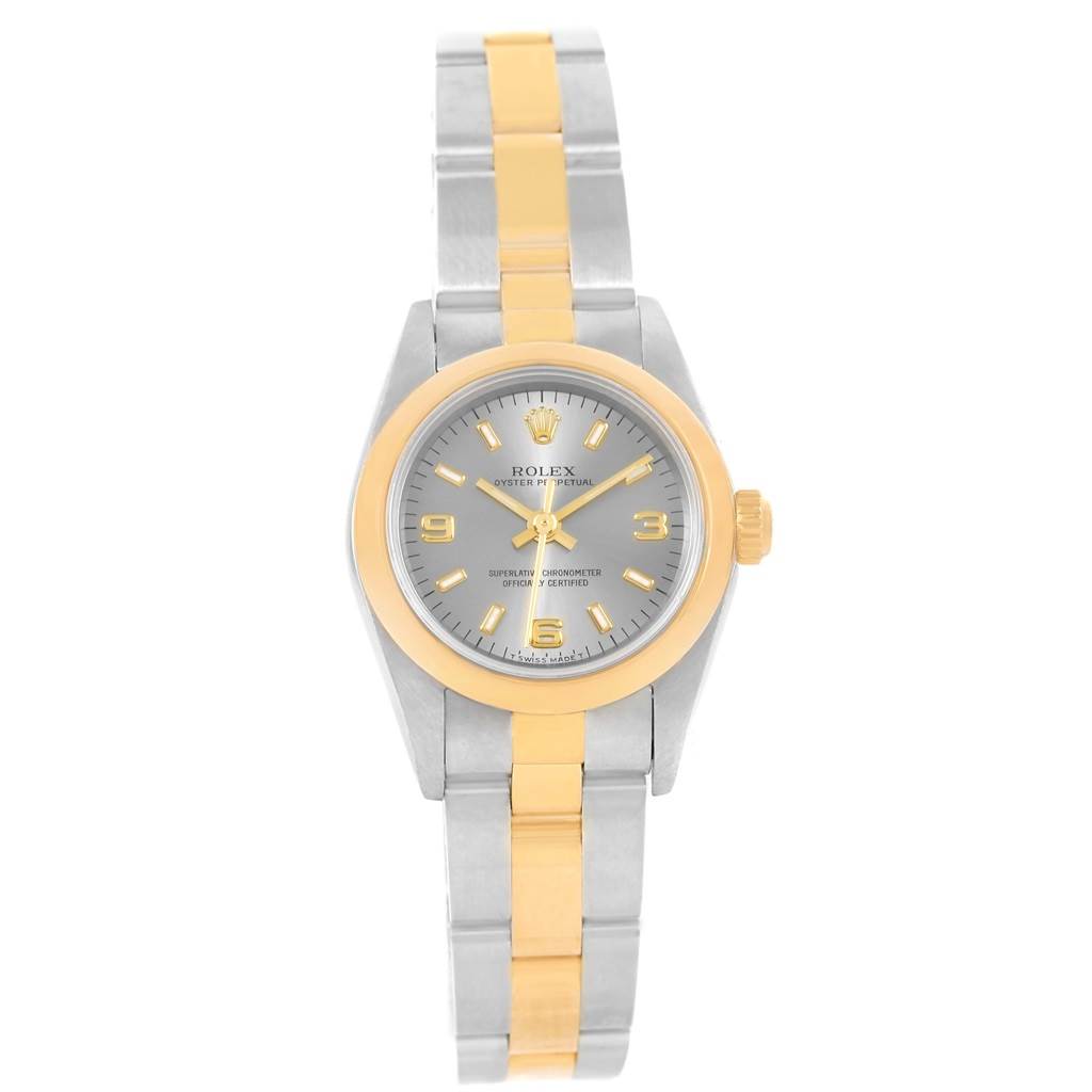 The image shows a Rolex Oyster Perpetual 76183 Women's Steel and Gold (two tone) Grey Dial 76183 Women's Steel and Gold (two tone) Grey Dial watch from a top-down angle, featuring a two-tone bracelet and a gray dial.