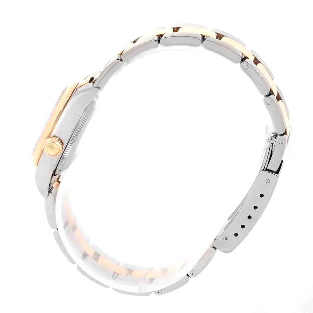 The Rolex Oyster Perpetual 76183 Women's Steel and Gold (two tone) Grey Dial 76183 Women's Steel and Gold (two tone) Grey Dial watch is shown from a side profile, highlighting the bracelet, case, and crown.