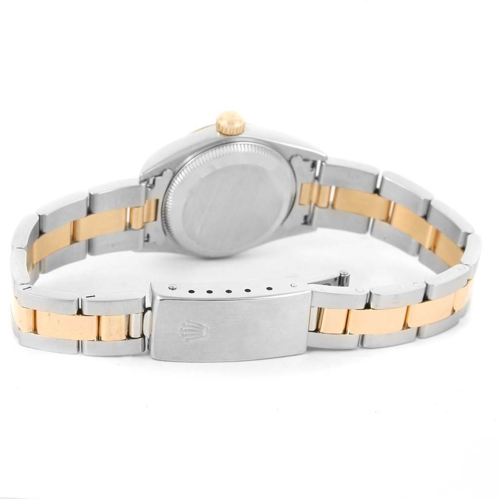 The image shows the back of a Rolex Oyster Perpetual 76183 Women's Steel and Gold (two tone) Grey Dial 76183 Women's Steel and Gold (two tone) Grey Dial watch and its two-tone bracelet.