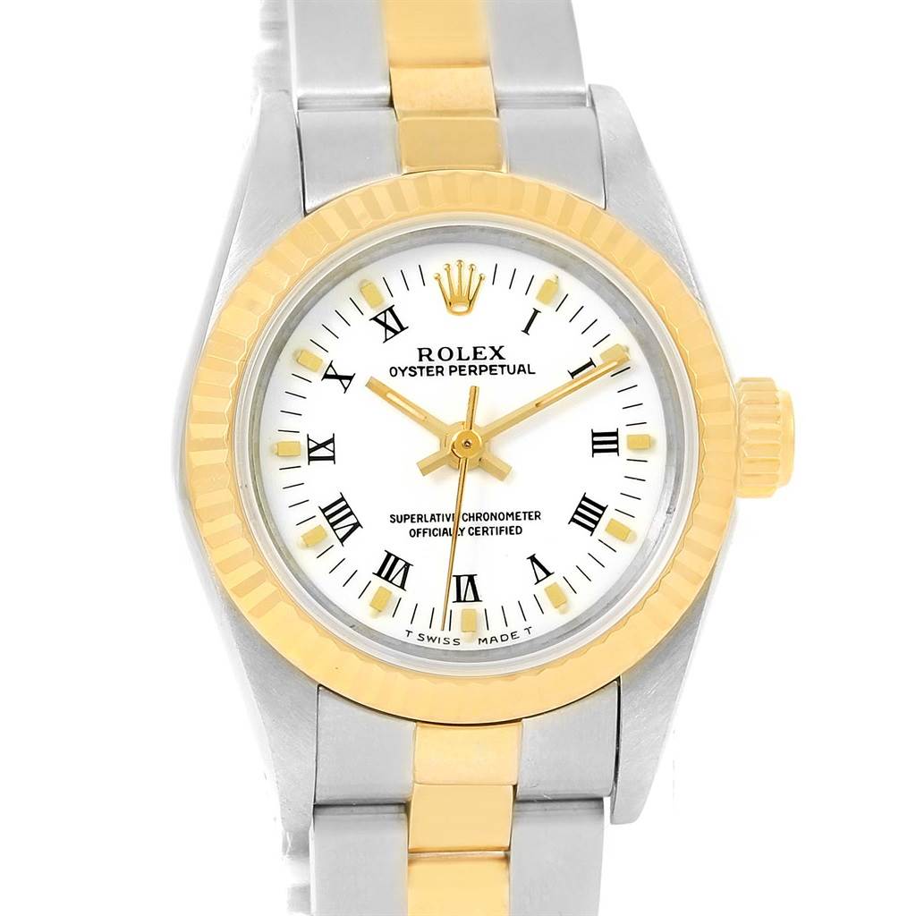 This image shows a front view of the Rolex Oyster Perpetual 67193 Women's Steel and Gold (two tone) White Dial 67193 Women's Steel and Gold (two tone) White Dial watch, highlighting the dial, bezel, and part of the band.