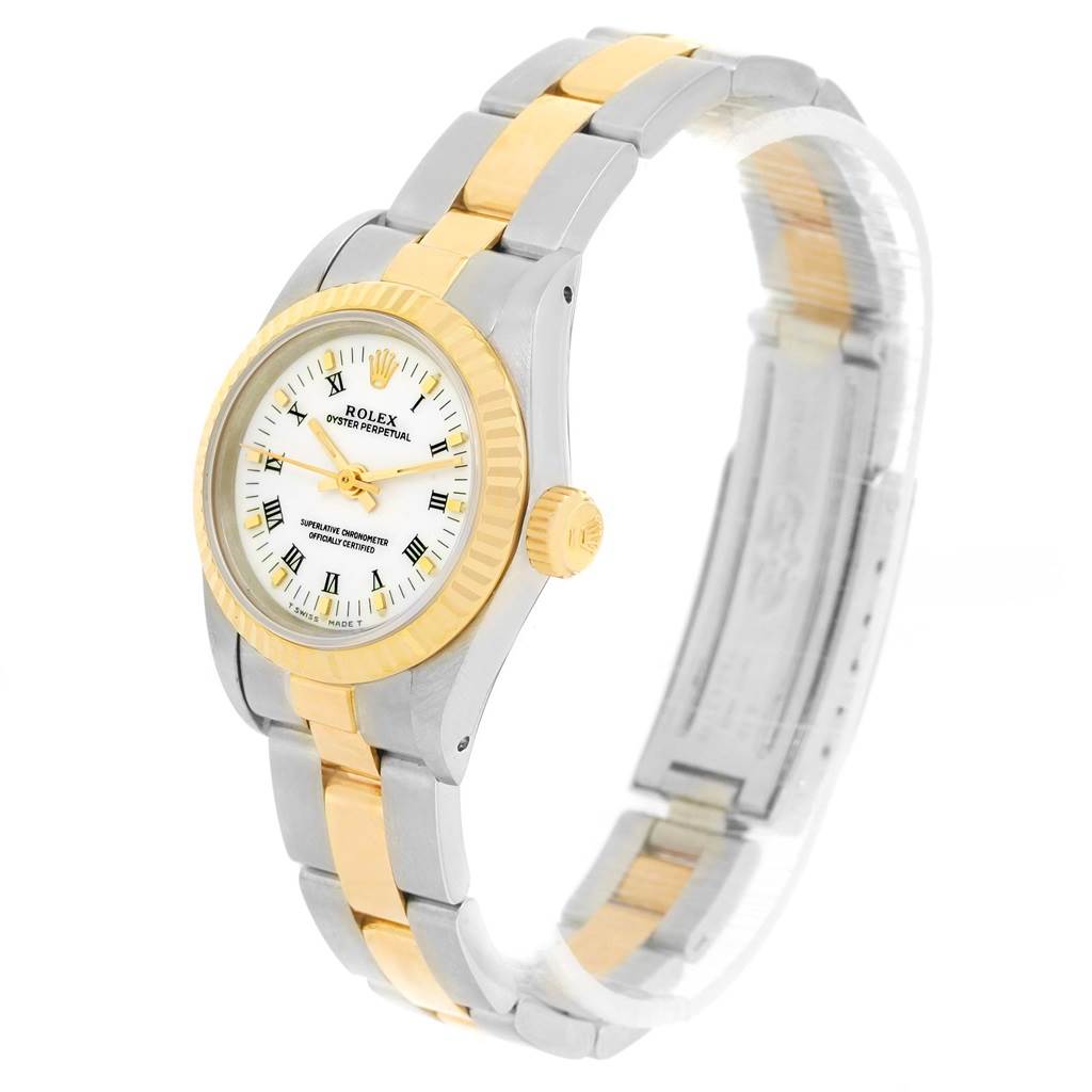 This image shows a Rolex Oyster Perpetual 67193 Women's Steel and Gold (two tone) White Dial 67193 Women's Steel and Gold (two tone) White Dial watch at an angle highlighting its bezel, dial, crown, and bracelet.