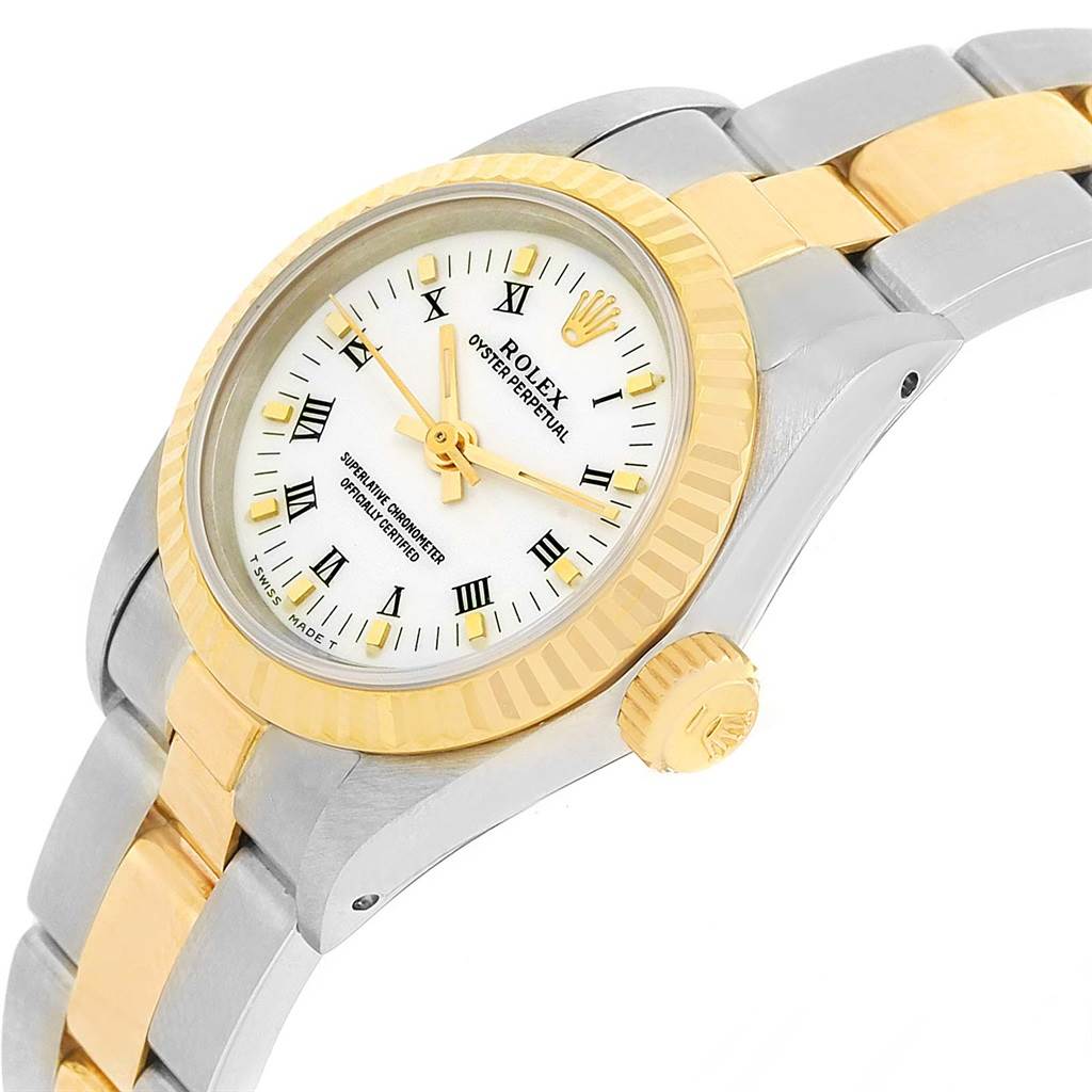 The image shows a close-up angled view of the Rolex Oyster Perpetual 67193 Women's Steel and Gold (two tone) White Dial 67193 Women's Steel and Gold (two tone) White Dial, highlighting the bezel, dial, crown, and bracelet.
