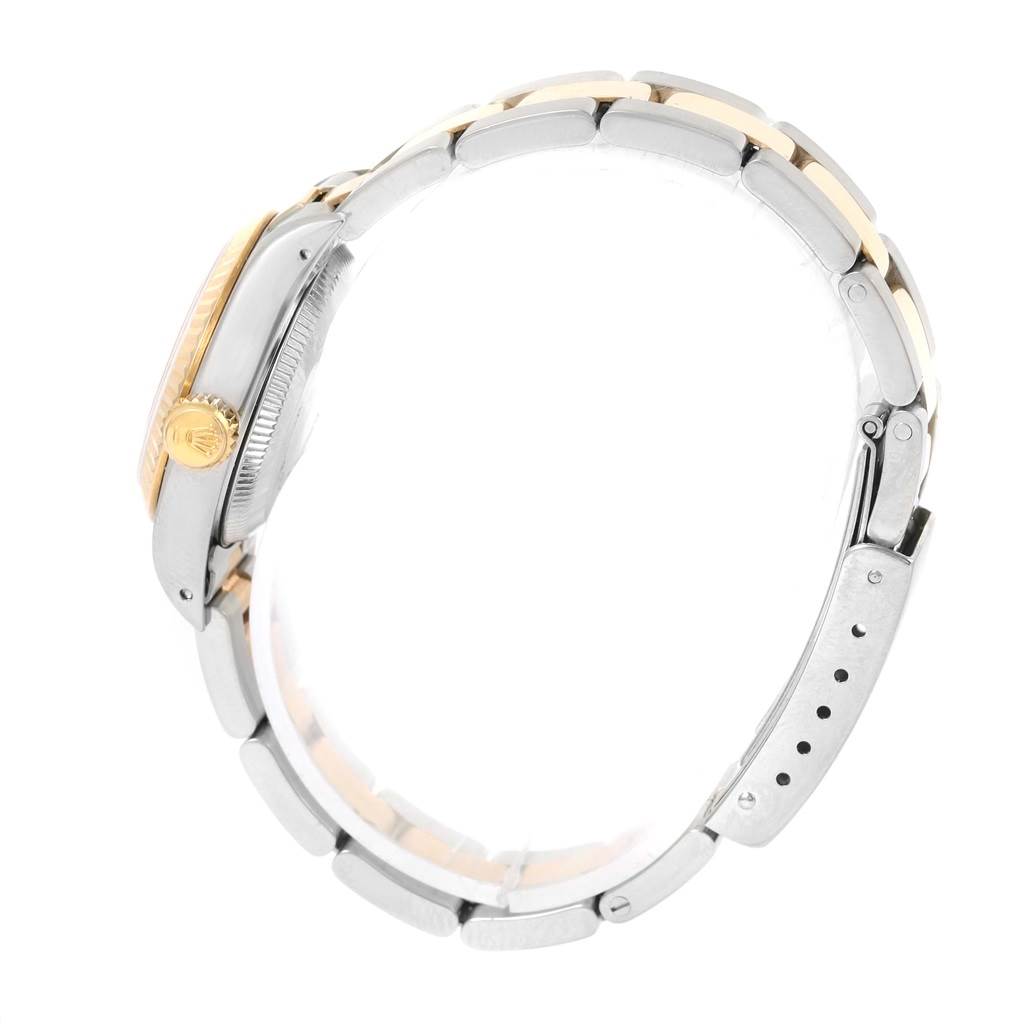 The image shows a side-view angle of the Oyster Perpetual Rolex watch, highlighting the crown and bracelet clasp.