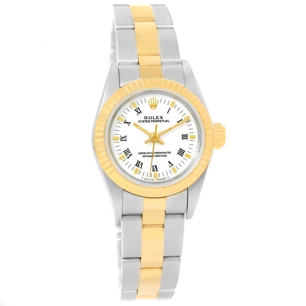 This Rolex Oyster Perpetual 67193 Women's Steel and Gold (two tone) White Dial 67193 Women's Steel and Gold (two tone) White Dial watch is shown from a top-down angle, highlighting its mixed metal bracelet and white dial with Roman numerals.