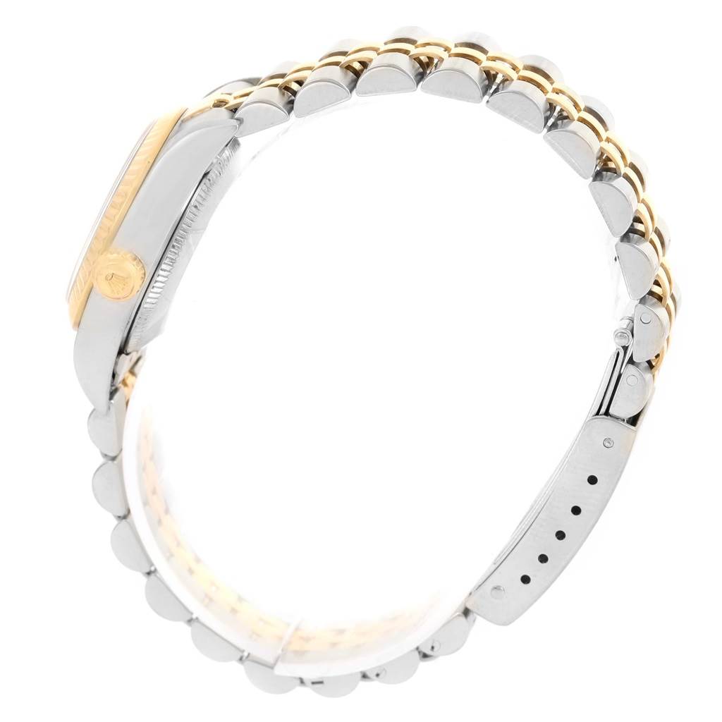 This image shows a side view of the Rolex Oyster Perpetual 76193 Women's Steel and Gold (two tone) White Dial 76193 Women's Steel and Gold (two tone) White Dial watch, highlighting its two-tone bracelet and the case with the crown.