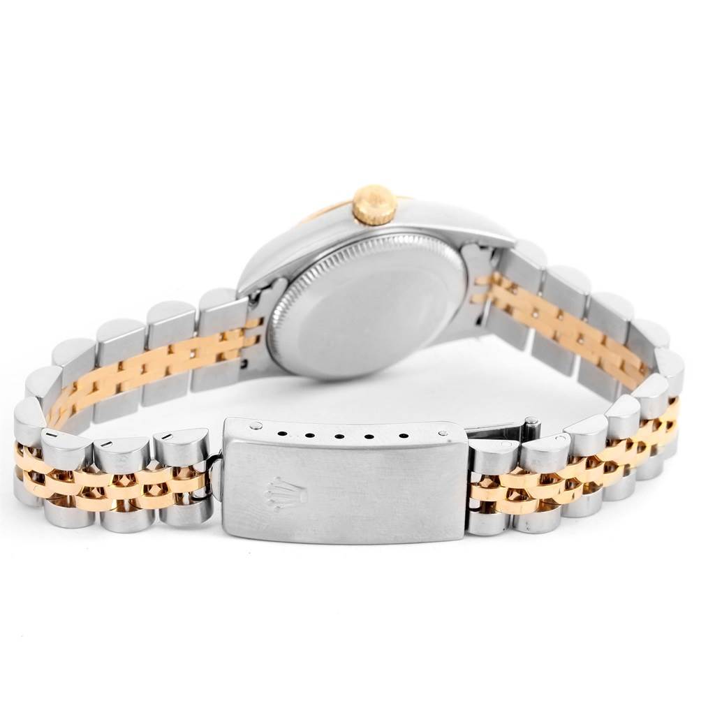 This image shows the back of a Rolex Oyster Perpetual 76193 Women's Steel and Gold (two tone) White Dial 76193 Women's Steel and Gold (two tone) White Dial watch, focusing on the caseback and the clasp of the bracelet.