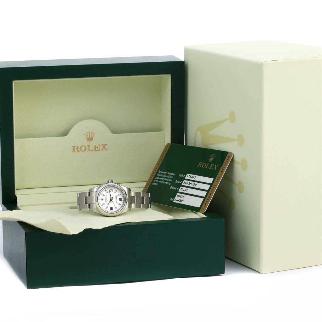The image shows a Rolex Oyster Perpetual 176200 Women's Stainless Steel White Dial 176200 Women's Stainless Steel White Dial watch in its opened box along with a warranty card placed beside the box.