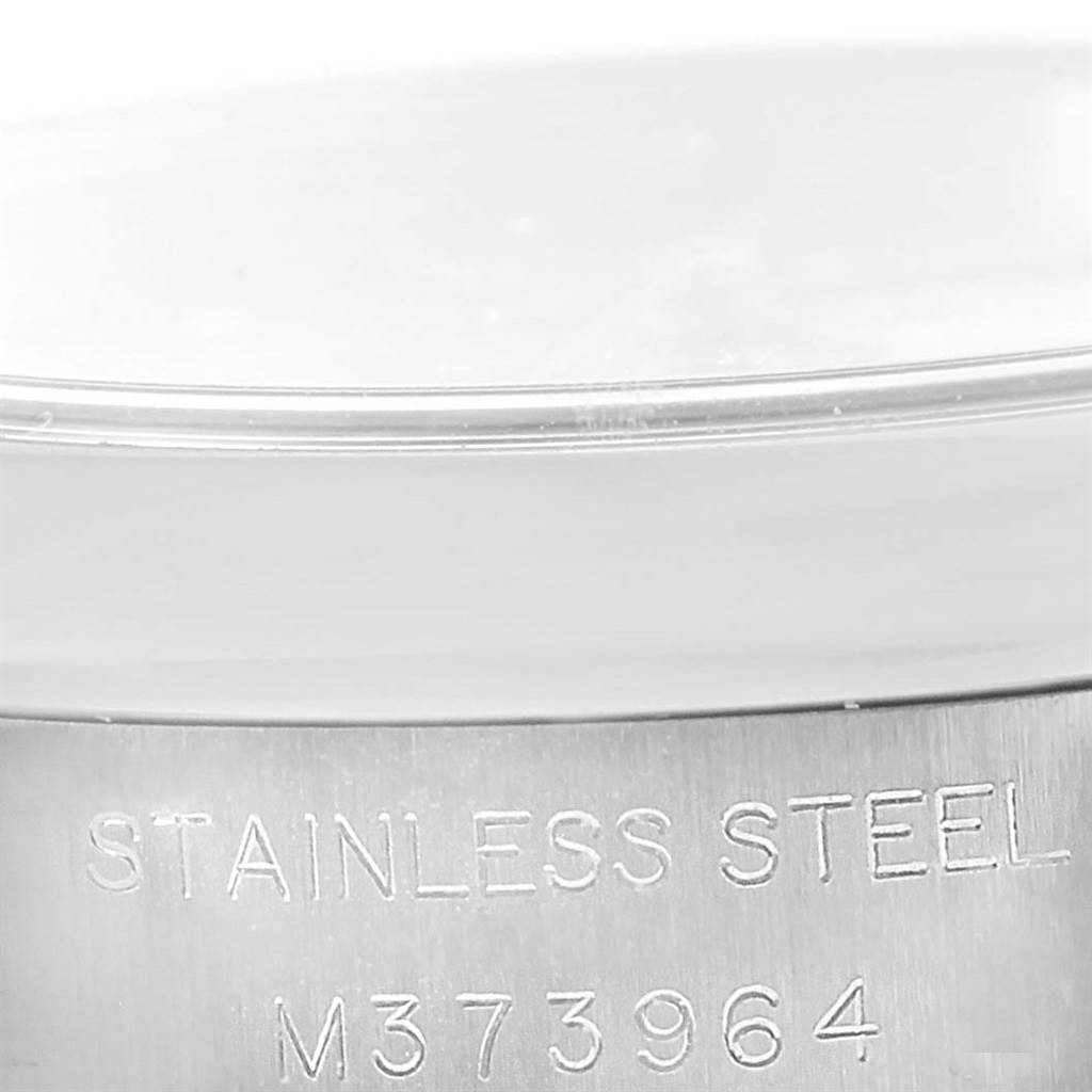 This image shows a close-up angle of the stainless steel casing and serial number of a Rolex Oyster Perpetual 176200 Women
s Stainless Steel Silver Dial 176200 Women
s Stainless Steel Silver Dial watch.