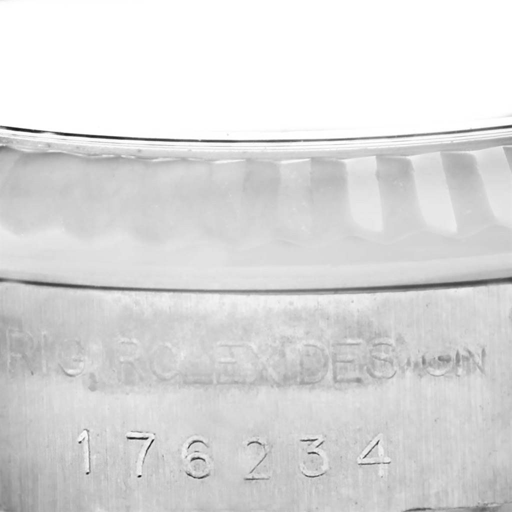 The image shows a close-up of the model number and "Rolex Design" engraving on the case of a Rolex Oyster Perpetual 176234 Women
s Stainless Steel Black Dial 176234 Women
s Stainless Steel Black Dial watch.