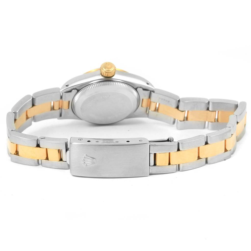 The image shows the back view of a Rolex Oyster Perpetual 67193 Women's Steel and Gold (two tone) Champagne Dial 67193 Women's Steel and Gold (two tone) Champagne Dial watch, focusing on the clasp, bracelet, and case back.