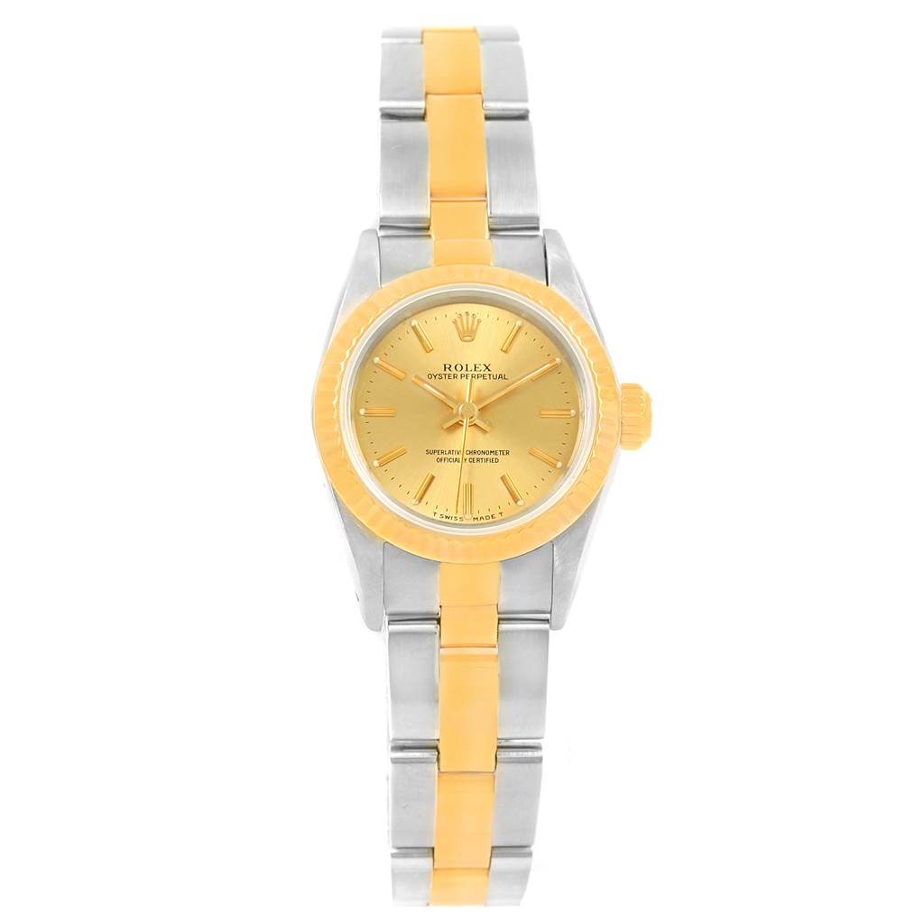 The image shows a frontal view of a Rolex Oyster Perpetual 67193 Women's Steel and Gold (two tone) Champagne Dial 67193 Women's Steel and Gold (two tone) Champagne Dial watch, highlighting its two-tone band and gold dial.