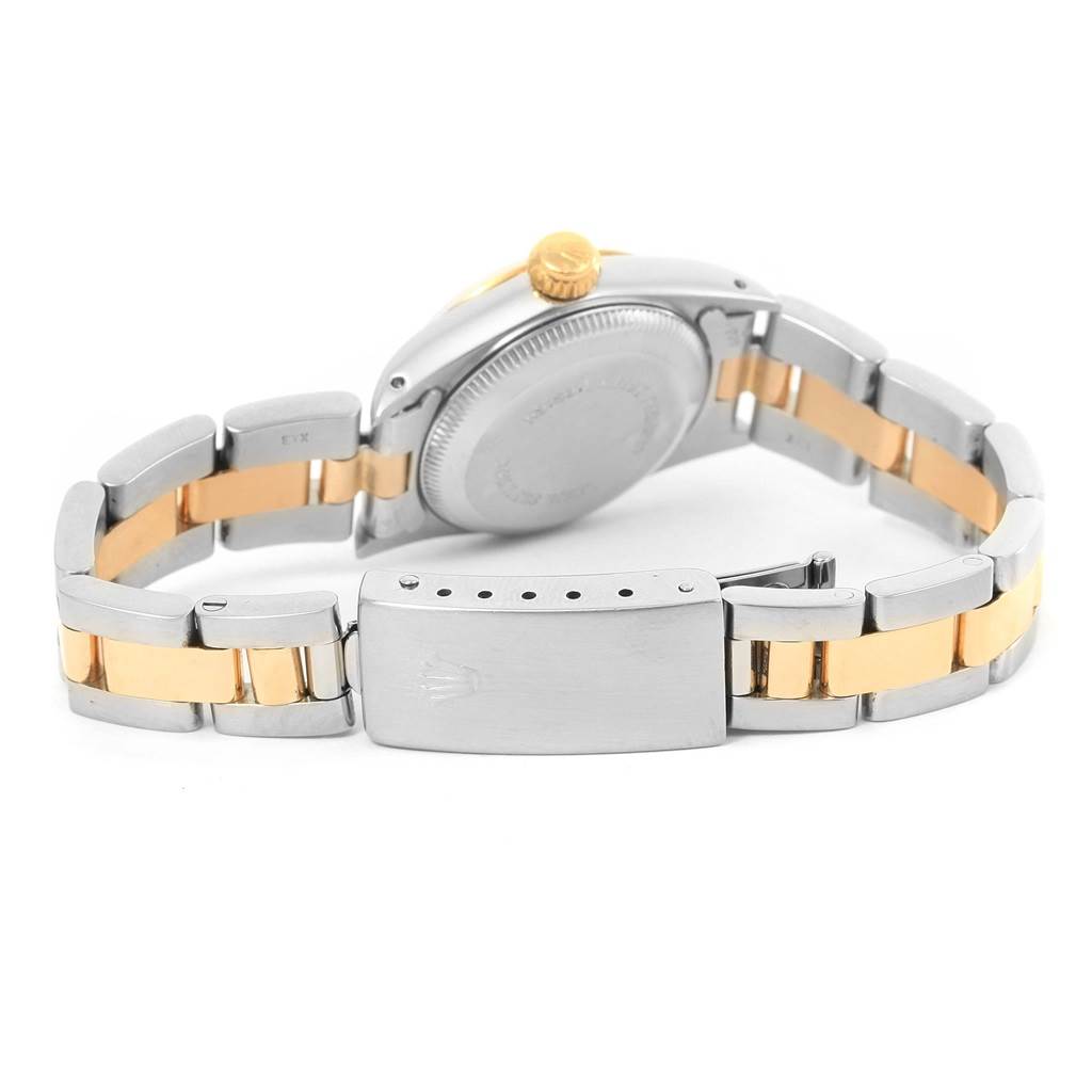 This image shows the back view of a Rolex Oyster Perpetual 67193 Women's Steel and Gold (two tone) Champagne Dial 67193 Women's Steel and Gold (two tone) Champagne Dial watch, highlighting its stainless steel and gold bracelet and clasp.