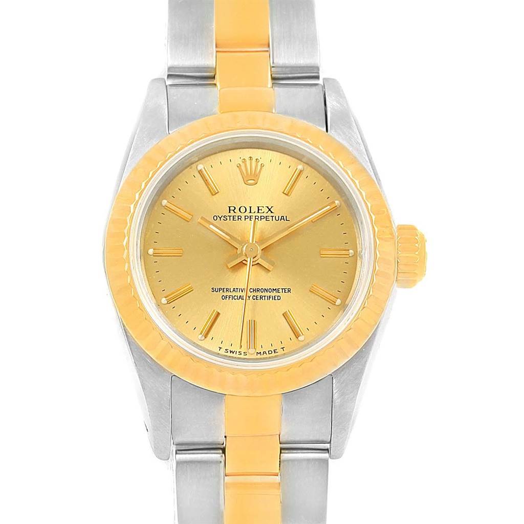 This image shows a frontal view of a Rolex Oyster Perpetual 67193 Women's Steel and Gold (two tone) Champagne Dial 67193 Women's Steel and Gold (two tone) Champagne Dial watch with a two-toned bracelet and a gold dial.