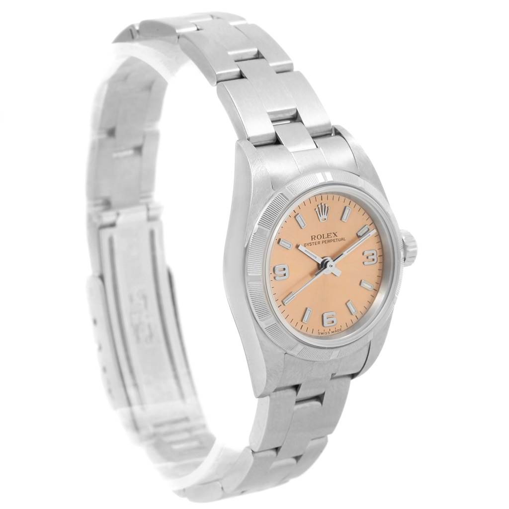The Rolex Oyster Perpetual 76030 Women
s Stainless Steel Pink Dial 76030 Women
s Stainless Steel Pink Dial watch is shown from a side angle, displaying its bracelet, bezel, crown, and dial.