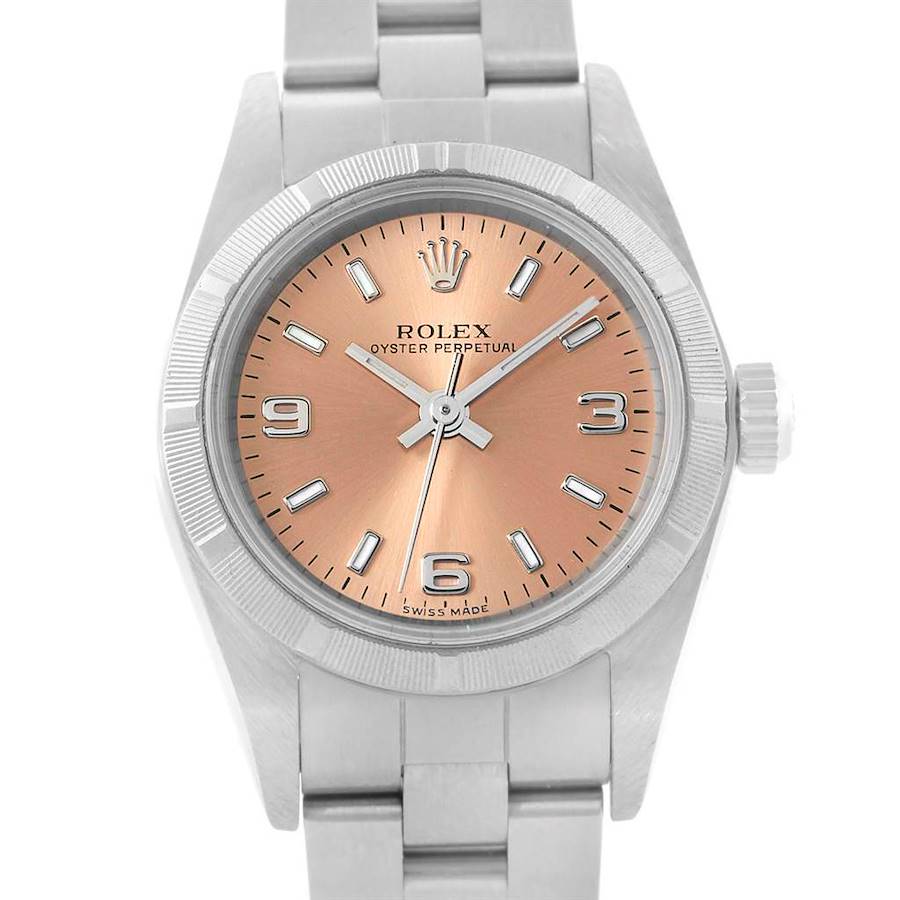 The image shows a front view of a Rolex Oyster Perpetual watch, highlighting its pink dial, bezel, and bracelet.