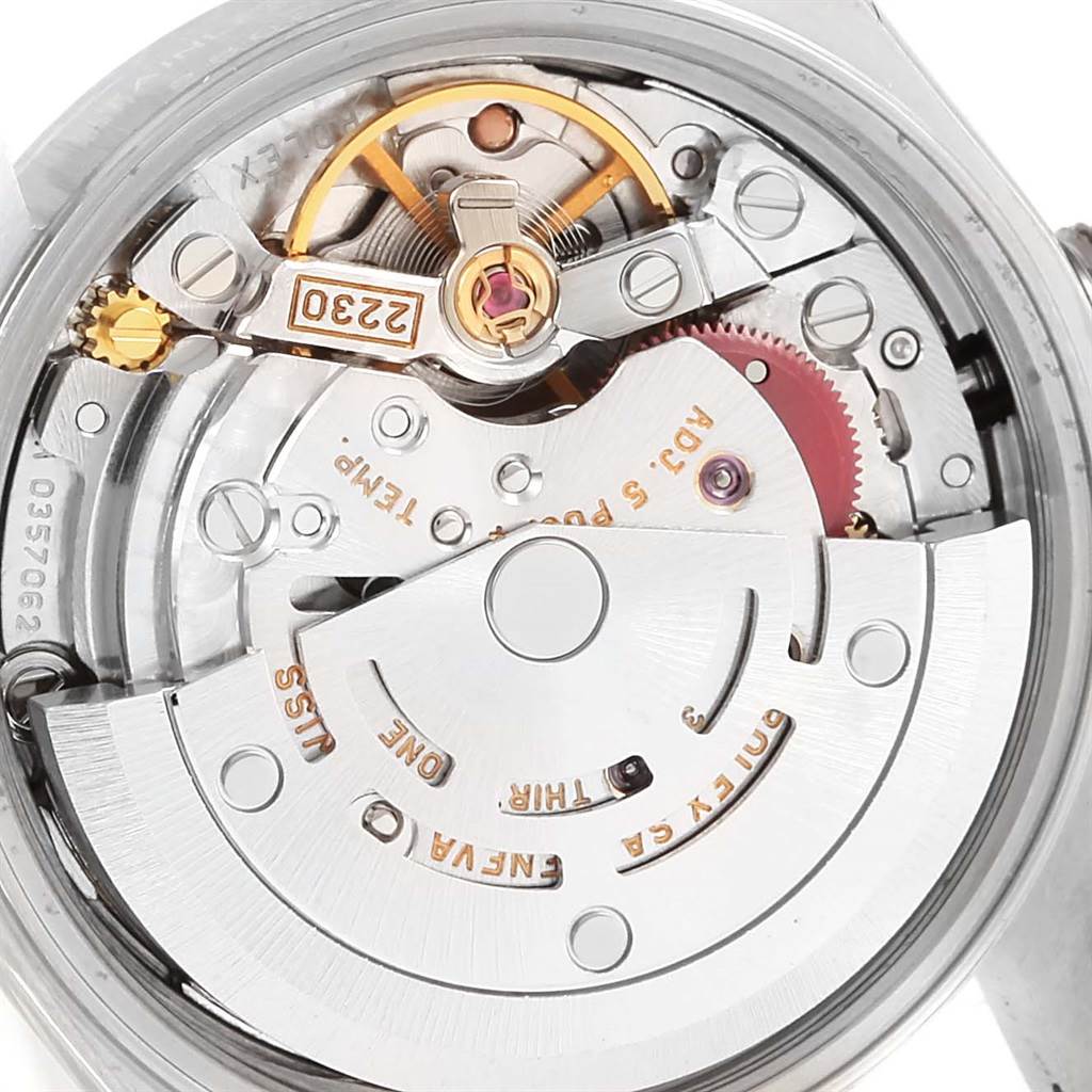 This is a close-up view of the movement of the Rolex Oyster Perpetual 76030 Women
s Stainless Steel Pink Dial 76030 Women
s Stainless Steel Pink Dial watch, showing intricate mechanical parts.