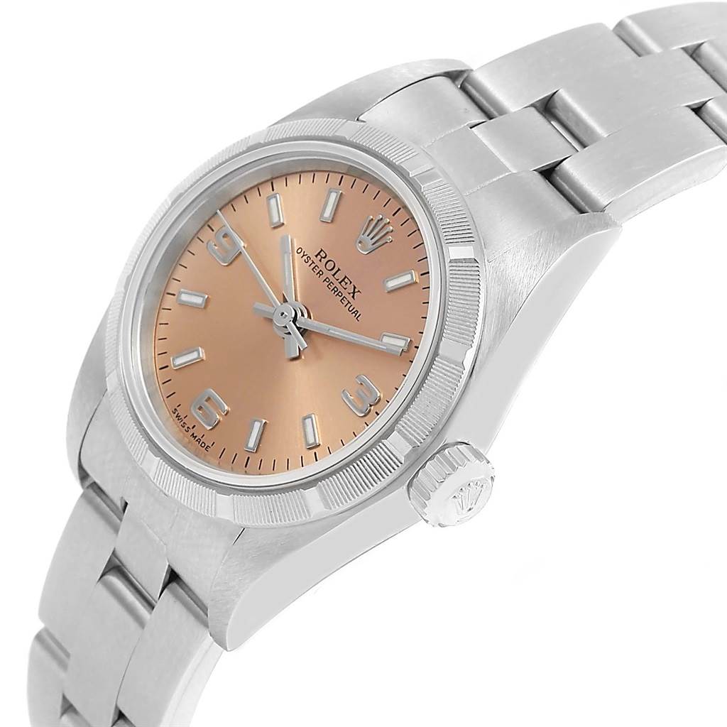 The image shows a side angle of a Rolex Oyster Perpetual 76030 Women
s Stainless Steel Pink Dial 76030 Women
s Stainless Steel Pink Dial watch, highlighting the crown, case, and bracelet.