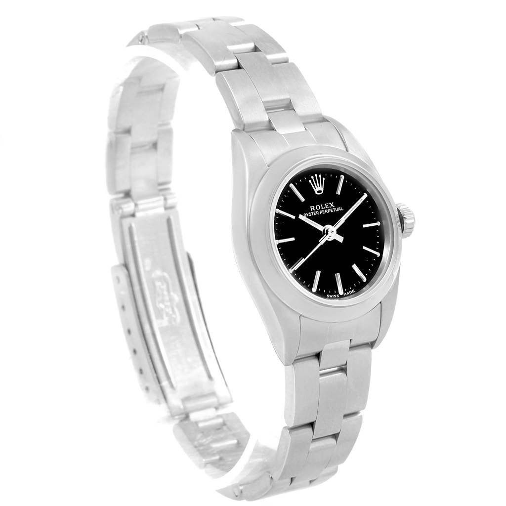 The image shows a Rolex Oyster Perpetual 76080 Women's Stainless Steel Black Dial 76080 Women's Stainless Steel Black Dial watch at an angle displaying the face, case, bracelet, and partially open clasp.