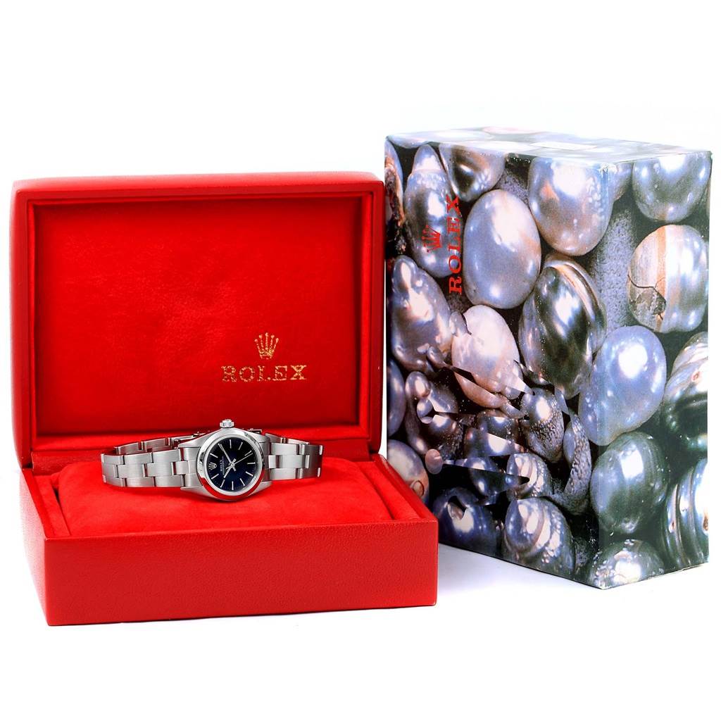 The image shows a Rolex Oyster Perpetual 76080 Women's Stainless Steel Black Dial 76080 Women's Stainless Steel Black Dial watch inside its red box, displayed at a straight-on angle.