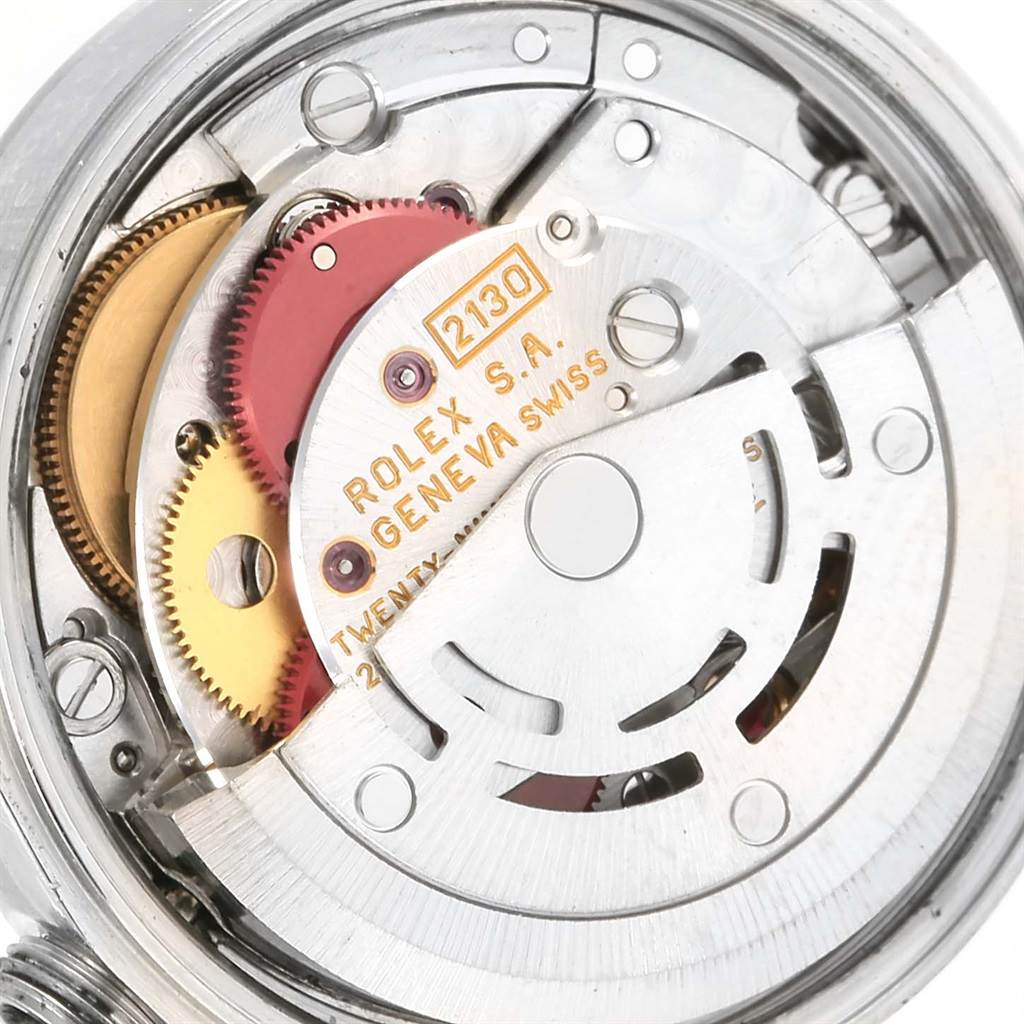 This image shows a close-up view of the movement mechanism inside a Rolex Oyster Perpetual 67180 Women
s Stainless Steel Pink Dial 67180 Women
s Stainless Steel Pink Dial watch.