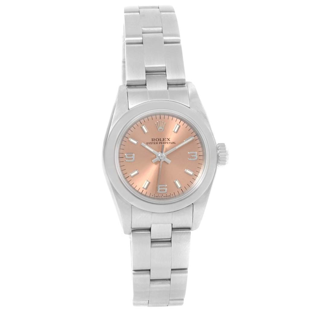 The image shows a front view of a Rolex Oyster Perpetual 67180 Women
s Stainless Steel Pink Dial 67180 Women
s Stainless Steel Pink Dial watch with a silver band and a rose gold dial.