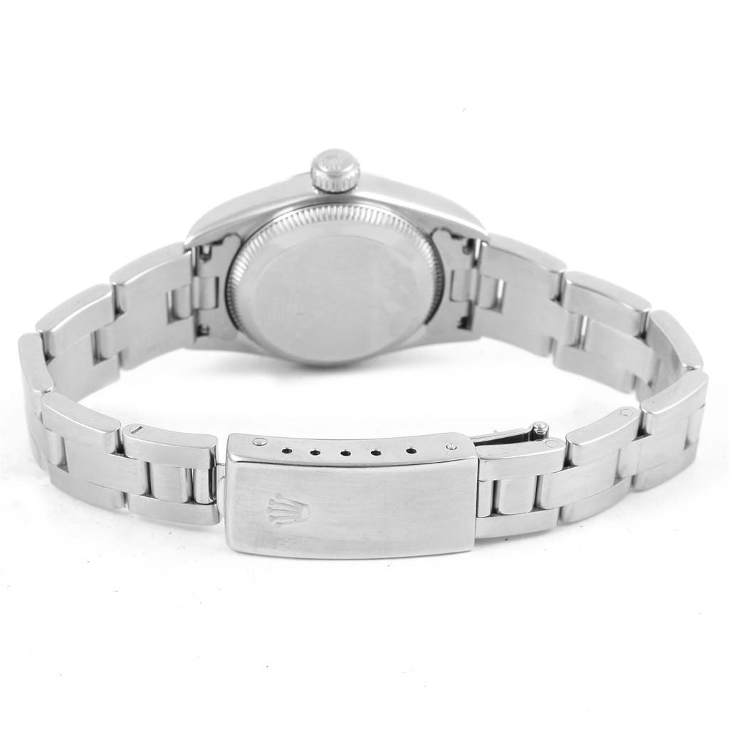 The image shows the back of a Rolex Oyster Perpetual 67180 Women
s Stainless Steel Pink Dial 67180 Women
s Stainless Steel Pink Dial watch, highlighting the caseback, bracelet, and clasp.