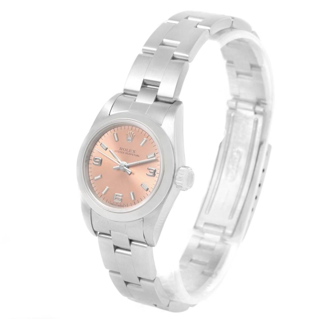 The image shows a Rolex Oyster Perpetual 67180 Women
s Stainless Steel Pink Dial 67180 Women
s Stainless Steel Pink Dial watch, angled slightly to display the face, bezel, crown, and bracelet.